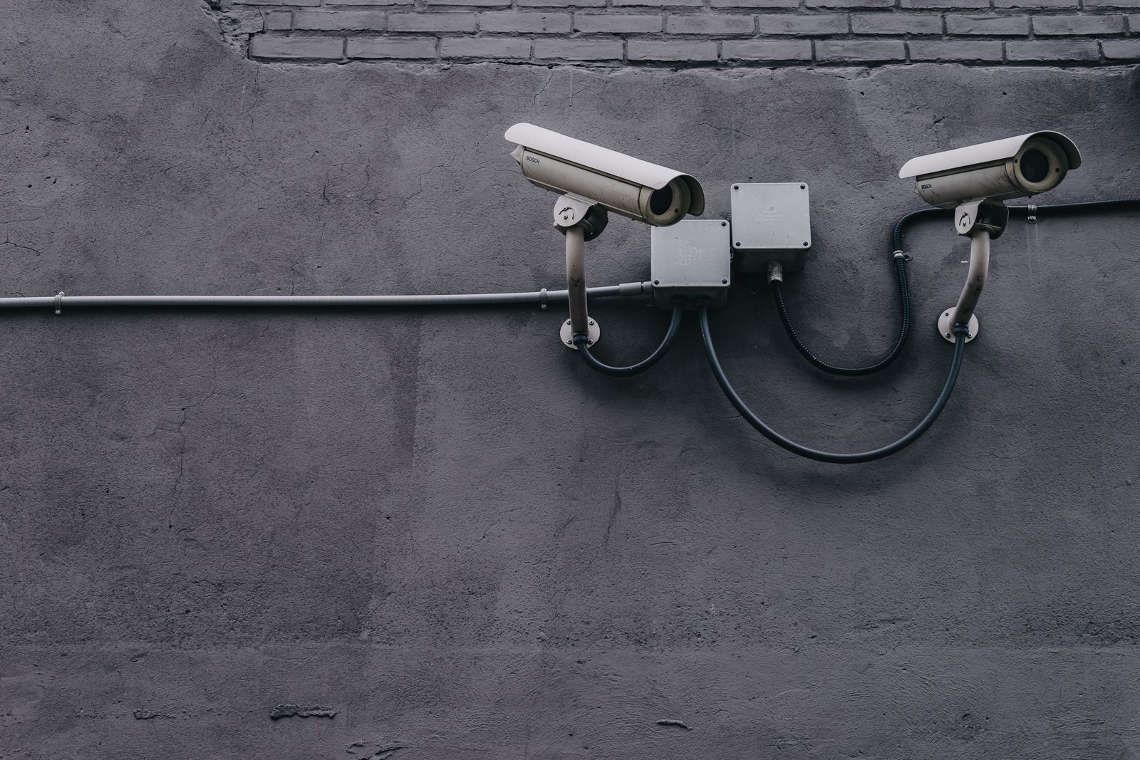 Modern Bosch CCTV cameras mounted on an office wall