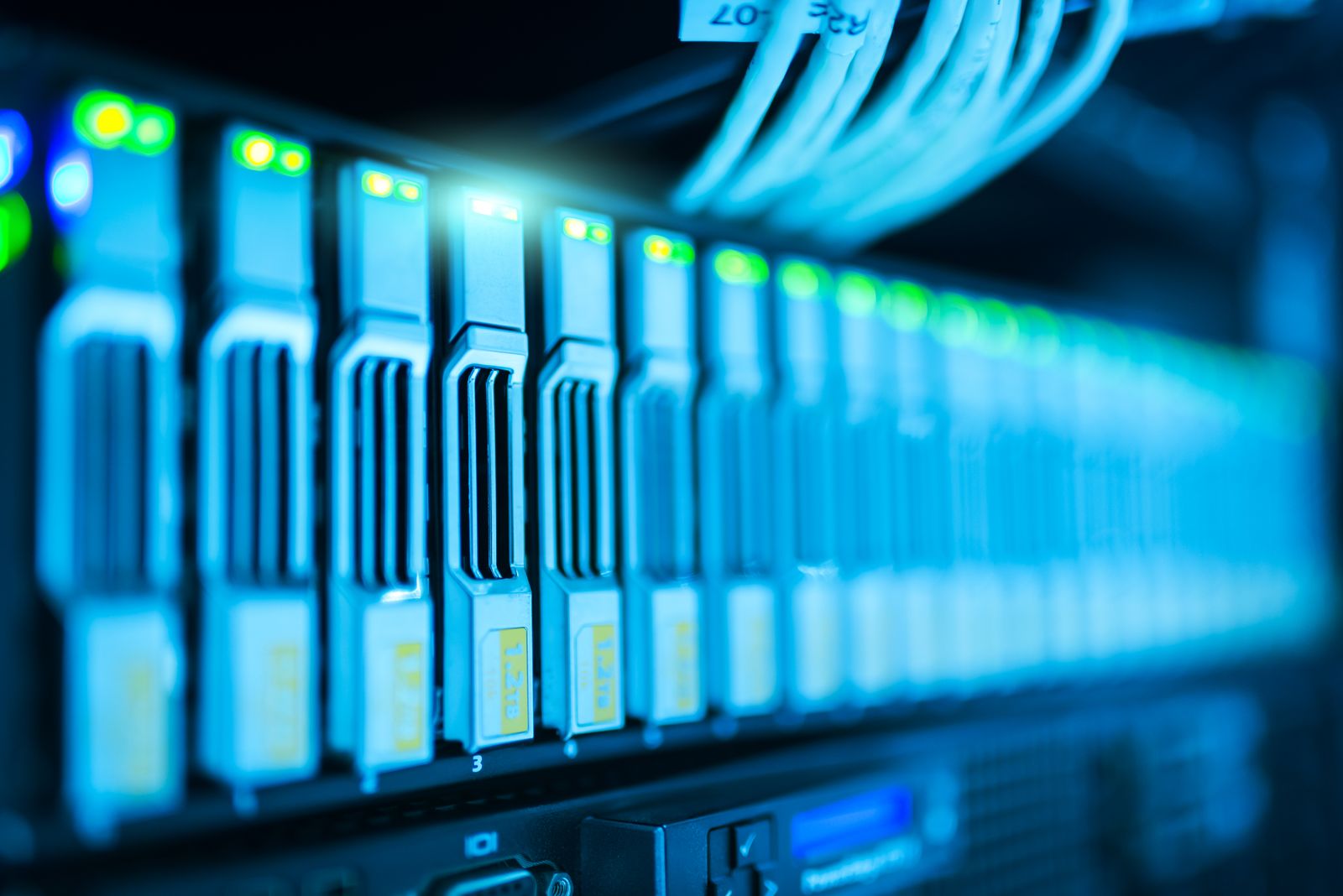 Blue-lit server blades in a modern data centre rack